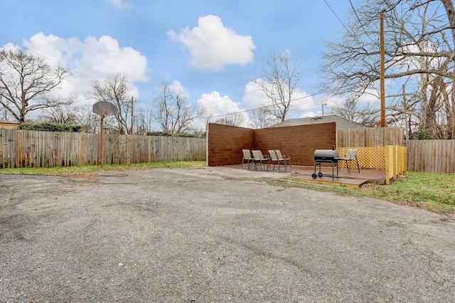 view of yard featuring a patio area and a deck