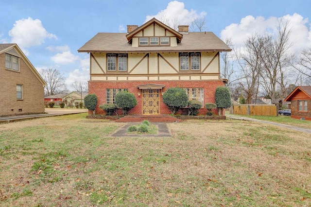 back of property featuring a yard