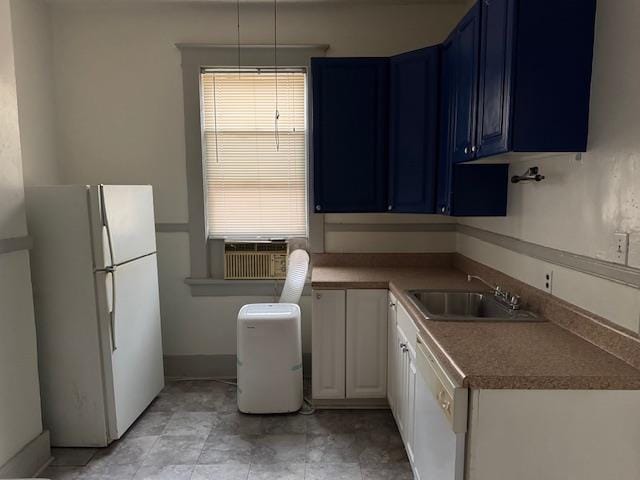 kitchen featuring white cabinetry, sink, white appliances, and blue cabinetry