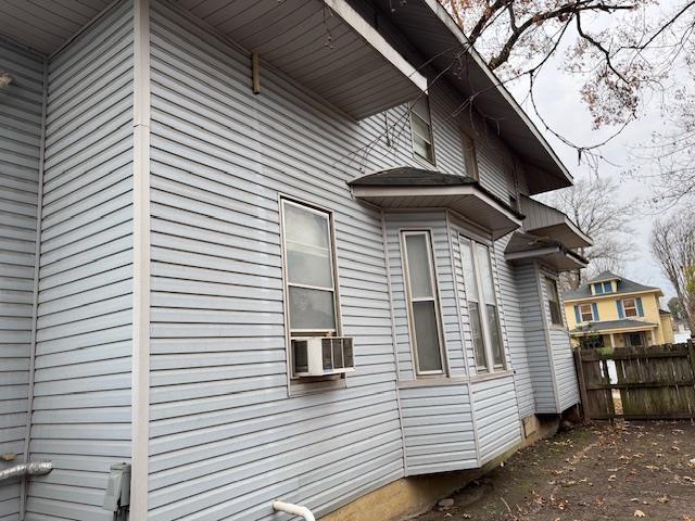 view of home's exterior with cooling unit