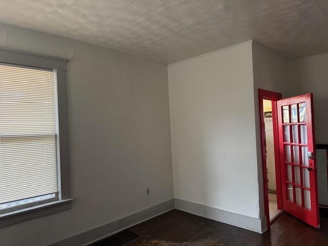 spare room featuring a textured ceiling