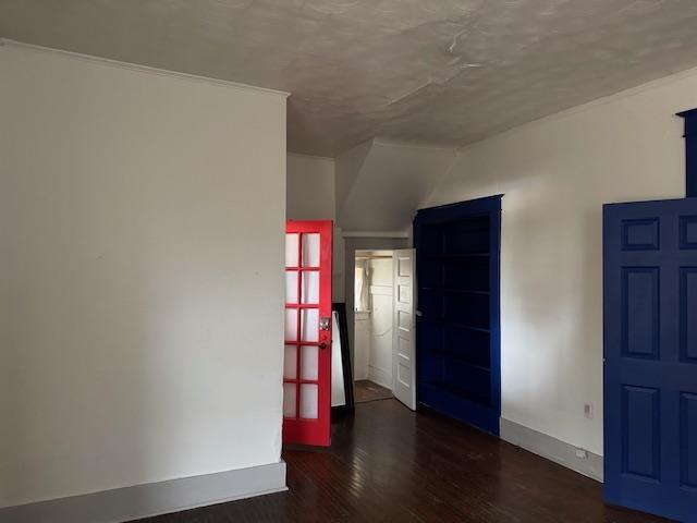 unfurnished room featuring dark hardwood / wood-style floors