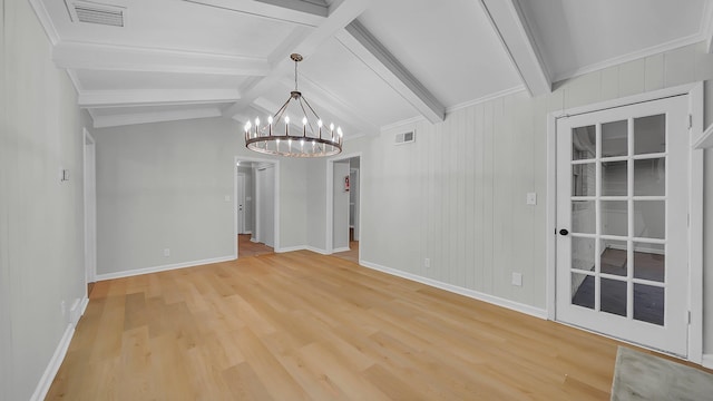 spare room featuring lofted ceiling with beams, light hardwood / wood-style flooring, and a notable chandelier