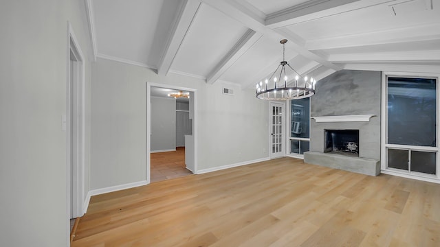 unfurnished living room featuring a chandelier, wood-type flooring, and vaulted ceiling with beams