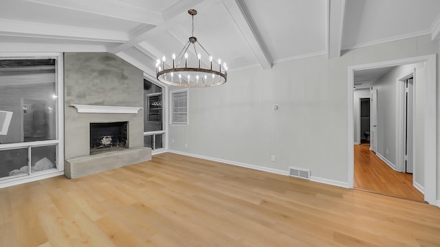 unfurnished living room with hardwood / wood-style floors, lofted ceiling with beams, and a notable chandelier