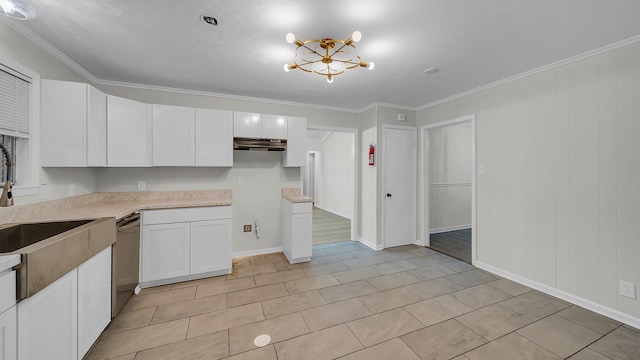 kitchen featuring white cabinets, stainless steel dishwasher, and crown molding