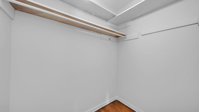 walk in closet featuring hardwood / wood-style floors