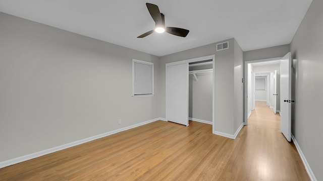 unfurnished bedroom with a closet, ceiling fan, and light hardwood / wood-style floors