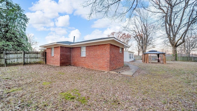 rear view of house with a gazebo