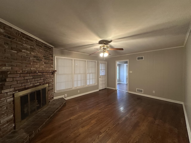 unfurnished living room featuring ornamental molding, a brick fireplace, ceiling fan, and dark wood-type flooring