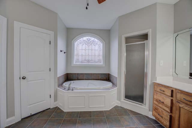 bathroom featuring tile patterned flooring, vanity, independent shower and bath, and ceiling fan