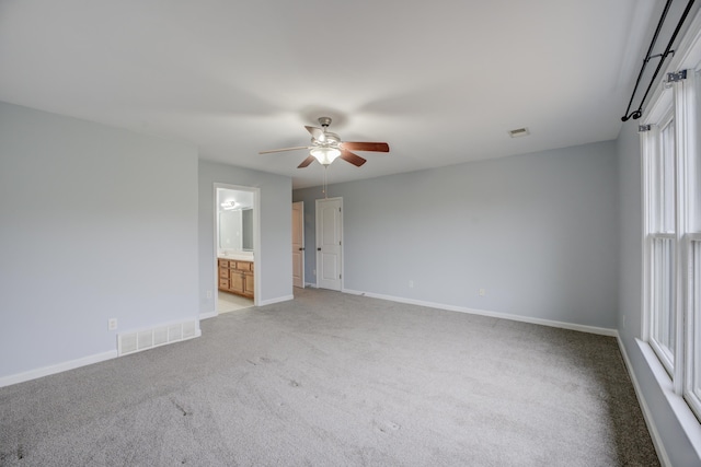 unfurnished room with light carpet and ceiling fan