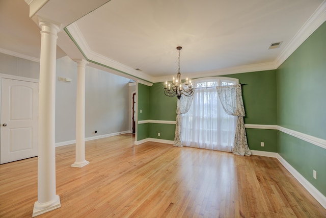 unfurnished dining area with a notable chandelier, wood-type flooring, and crown molding