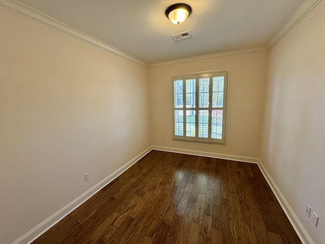 empty room with dark wood-type flooring and ornamental molding