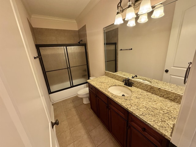 full bathroom with tile patterned flooring, toilet, shower / bath combination with glass door, vanity, and ornamental molding