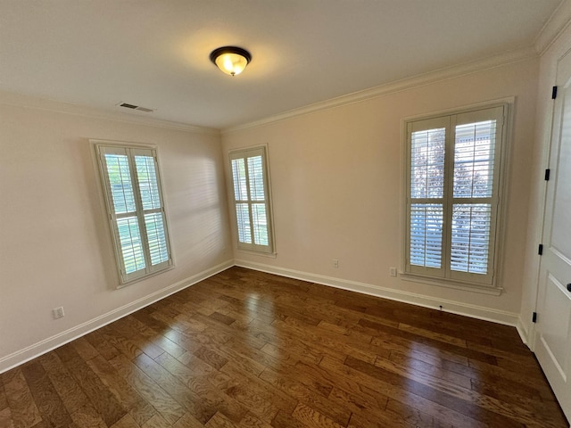 unfurnished room featuring a healthy amount of sunlight, dark hardwood / wood-style flooring, and ornamental molding