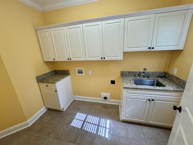 washroom featuring cabinets, hookup for a washing machine, hookup for an electric dryer, crown molding, and sink