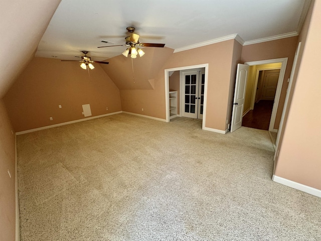 additional living space featuring ceiling fan, lofted ceiling, carpet floors, and french doors