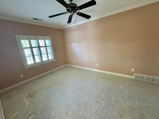 unfurnished room with ceiling fan, carpet floors, and ornamental molding