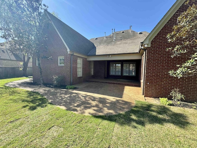 rear view of house with a lawn