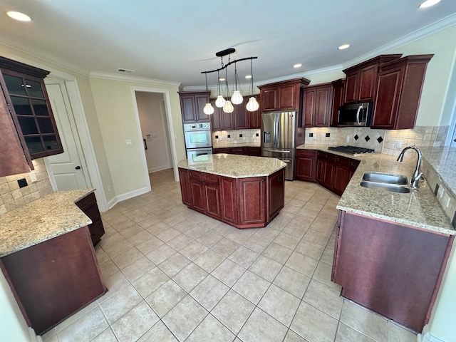 kitchen with decorative backsplash, sink, decorative light fixtures, and appliances with stainless steel finishes