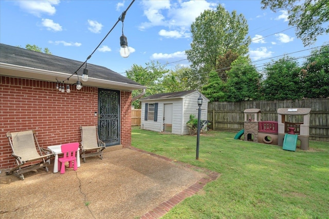 view of yard featuring a patio area and a storage shed