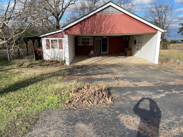 view of front of property with a carport