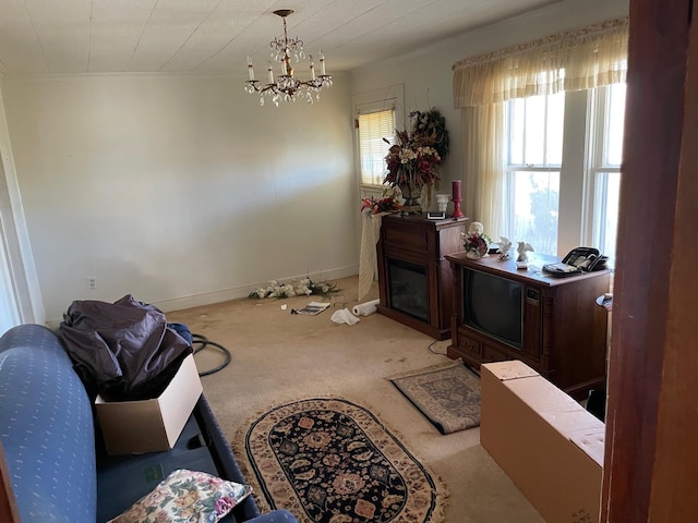 carpeted dining area featuring an inviting chandelier