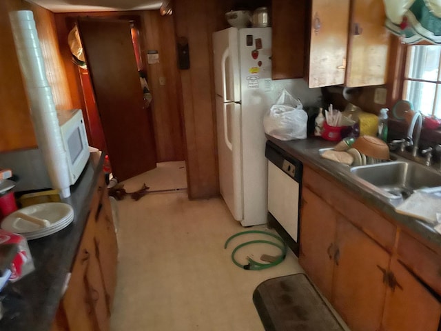 kitchen with white appliances and sink