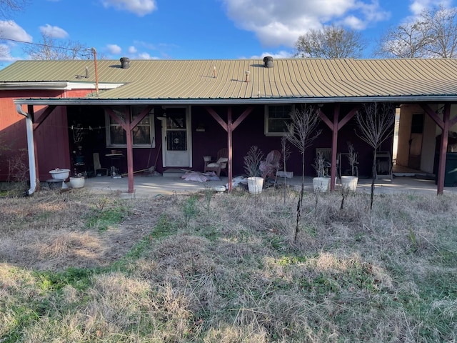 rear view of house featuring a patio