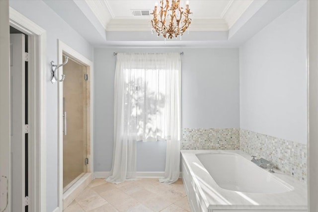 bathroom featuring a chandelier, a tray ceiling, separate shower and tub, and ornamental molding