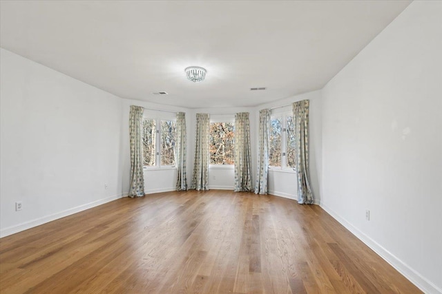 spare room featuring light hardwood / wood-style flooring