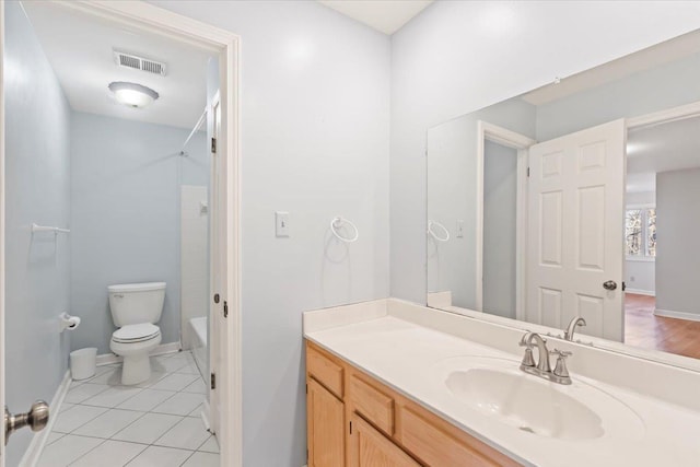 full bathroom with tile patterned floors, shower / washtub combination, vanity, and toilet