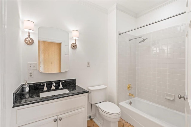 full bathroom with tile patterned floors, ornamental molding, vanity, tiled shower / bath combo, and toilet