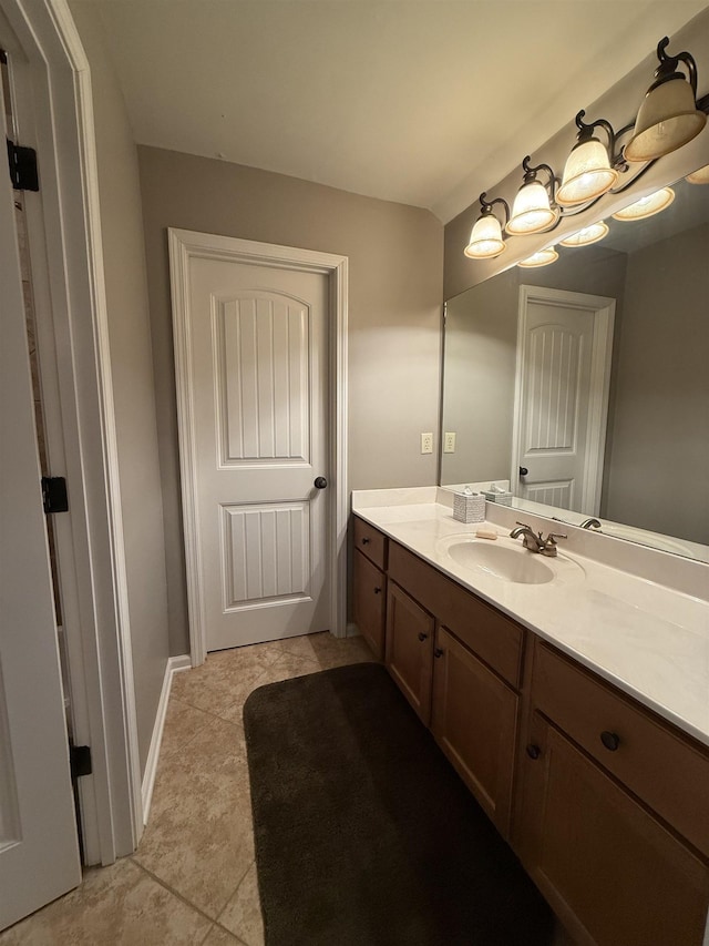 bathroom featuring tile patterned flooring and vanity