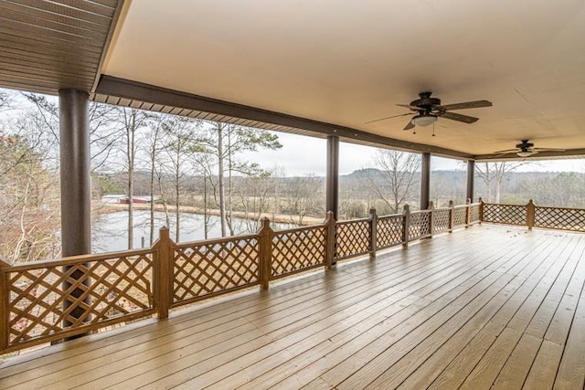 wooden terrace featuring ceiling fan