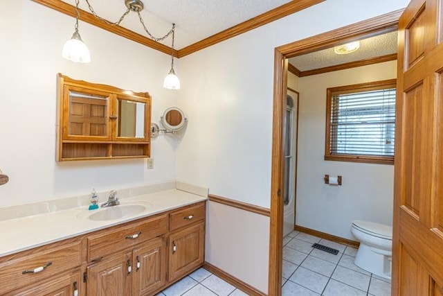 bathroom with tile patterned flooring, ornamental molding, and a textured ceiling