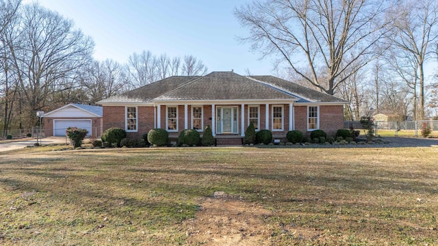 ranch-style house with a front lawn and covered porch