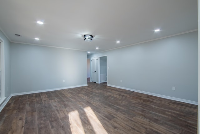 unfurnished room featuring dark hardwood / wood-style floors and ornamental molding