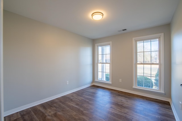 empty room featuring dark hardwood / wood-style floors