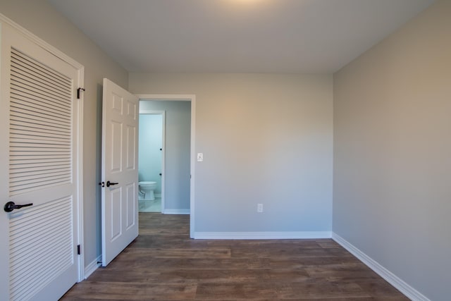 spare room with dark hardwood / wood-style flooring