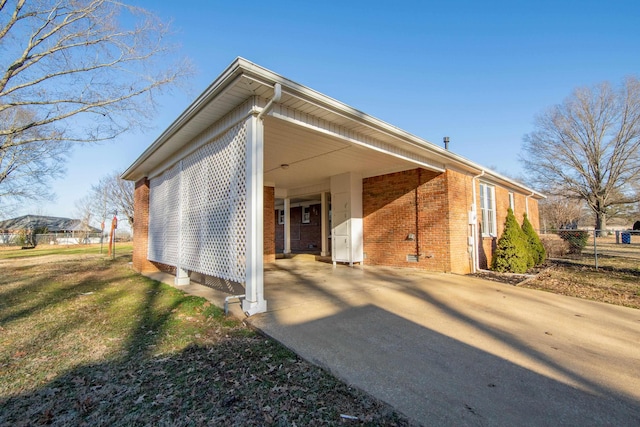 view of side of home featuring a carport