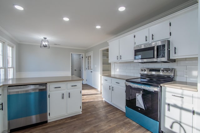 kitchen with white cabinets, dark wood-type flooring, stainless steel appliances, and tasteful backsplash