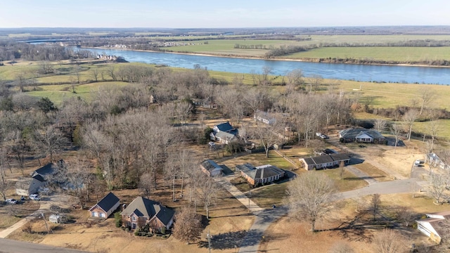 birds eye view of property with a rural view and a water view