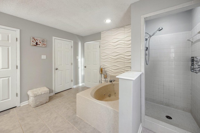 bathroom with tile patterned flooring, a textured ceiling, and independent shower and bath