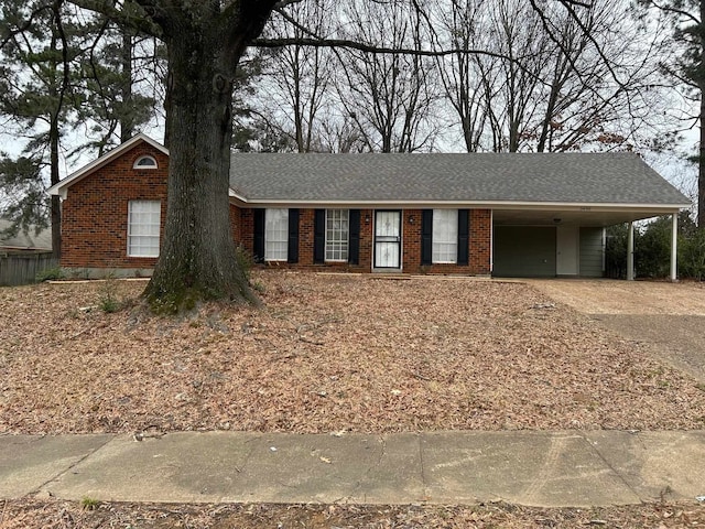 ranch-style home with a carport