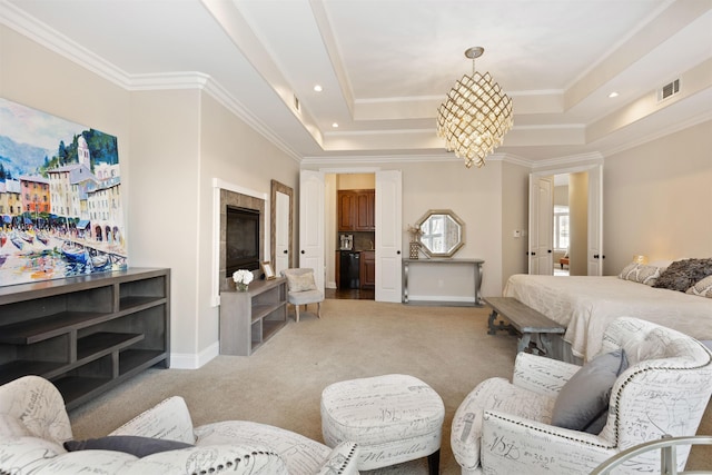 carpeted bedroom featuring a notable chandelier, crown molding, and a tray ceiling