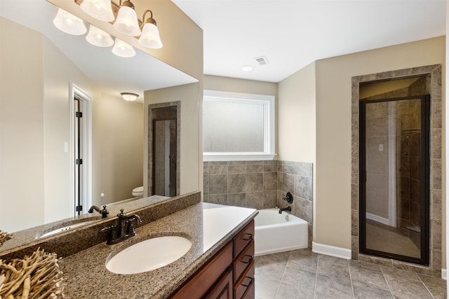 full bathroom featuring vanity, toilet, and independent shower and bath