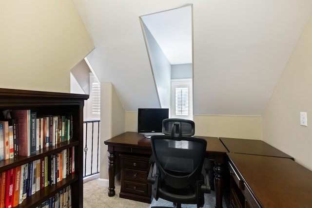 office featuring light colored carpet and lofted ceiling