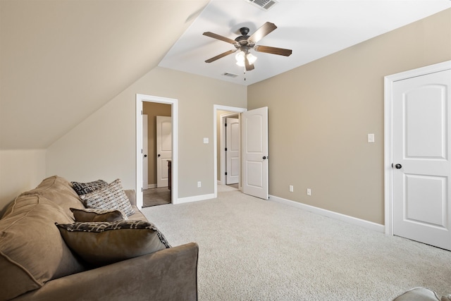 sitting room with ceiling fan, lofted ceiling, and light carpet